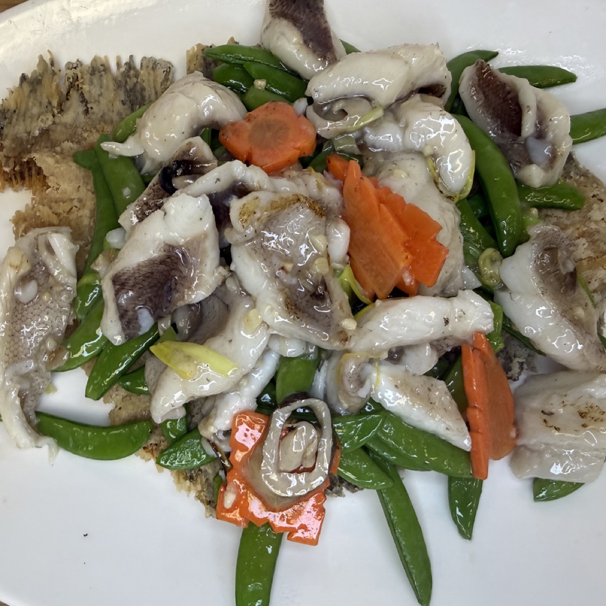 Slice of Sole Served with Crispy Bones